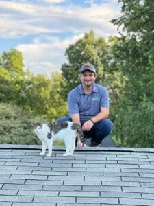 man with cat in front